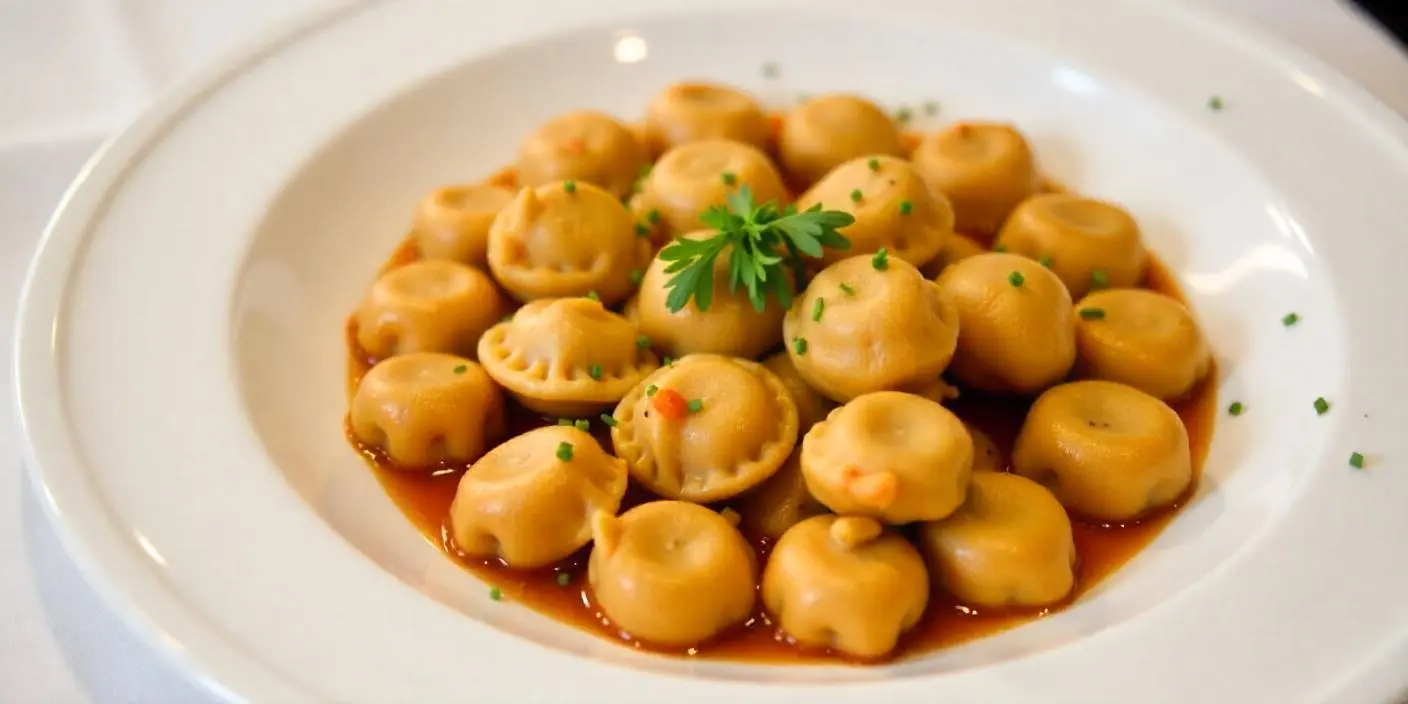 Gnocchi in Tomato Sauce – Soft gnocchi coated in a flavorful tomato-based sauce.