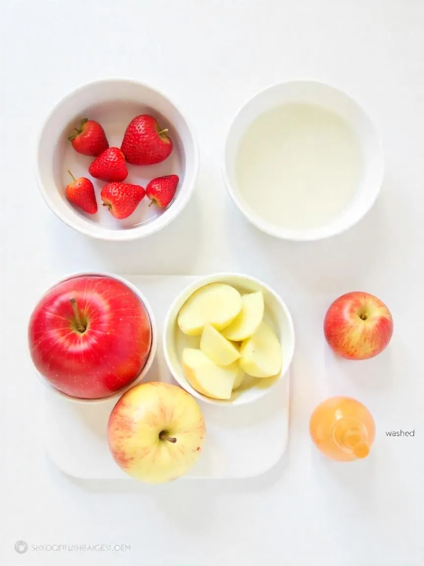 Side-by-side comparison of fruit being washed with vinegar, baking soda, and commercial produce wash on a clean kitchen counter. 