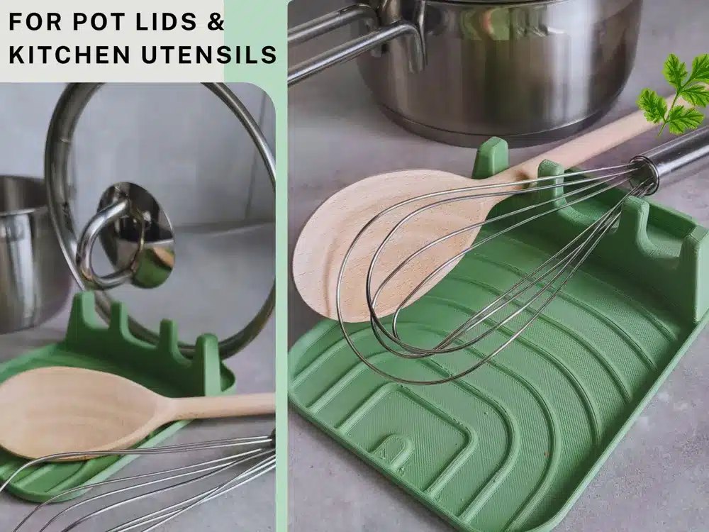 Green 3D printed rest holding a wooden spoon, whisk, and pot lid on a kitchen counter, designed to keep cooking tools organized and surfaces clean